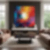 A collection of modern abstract paintings displayed in a stylish living room.